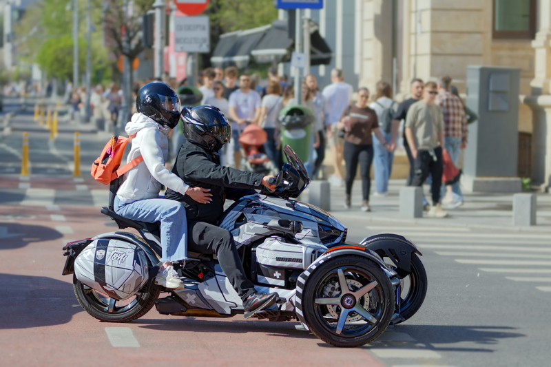 Three wheels vehicle waiting at the crossing